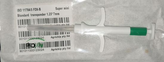 Picture of Microchip Pet SUPER Mini 1.25mm x 7mm including a pet record card.