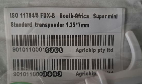 Picture of Microchip rfid fdx-b Pet SUPER Mini 1.25mm x 7mm including a pet record card.